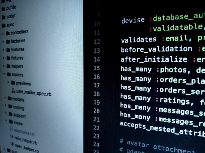 Close-up view of a computer screen displaying lines of HTML code with multi-colored syntax highlighting, including tags, attributes, and file paths. The code appears on a dark background, with text in